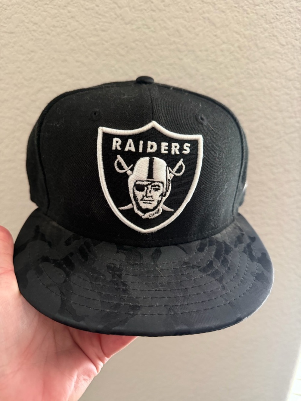 Oakland/Las Vegas Raiders Black Snapback Hat with Black Camo Rim
